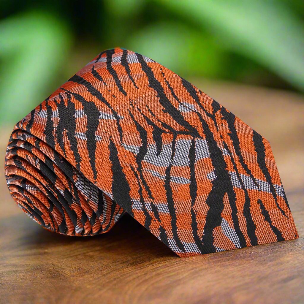 Bold tiger print silk tie showcasing vibrant colors and patterns, ideal for formal occasions.