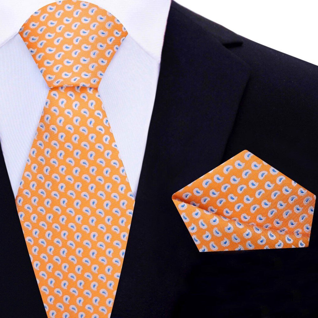 Matching paisley silk handkerchief and tie set on a stylish mens dress shirt