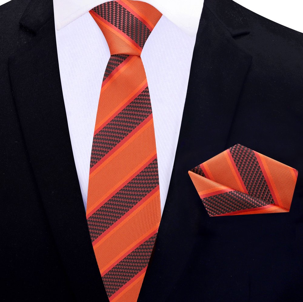 Close-up of classic striped silk necktie in blue and gold shades for business attire