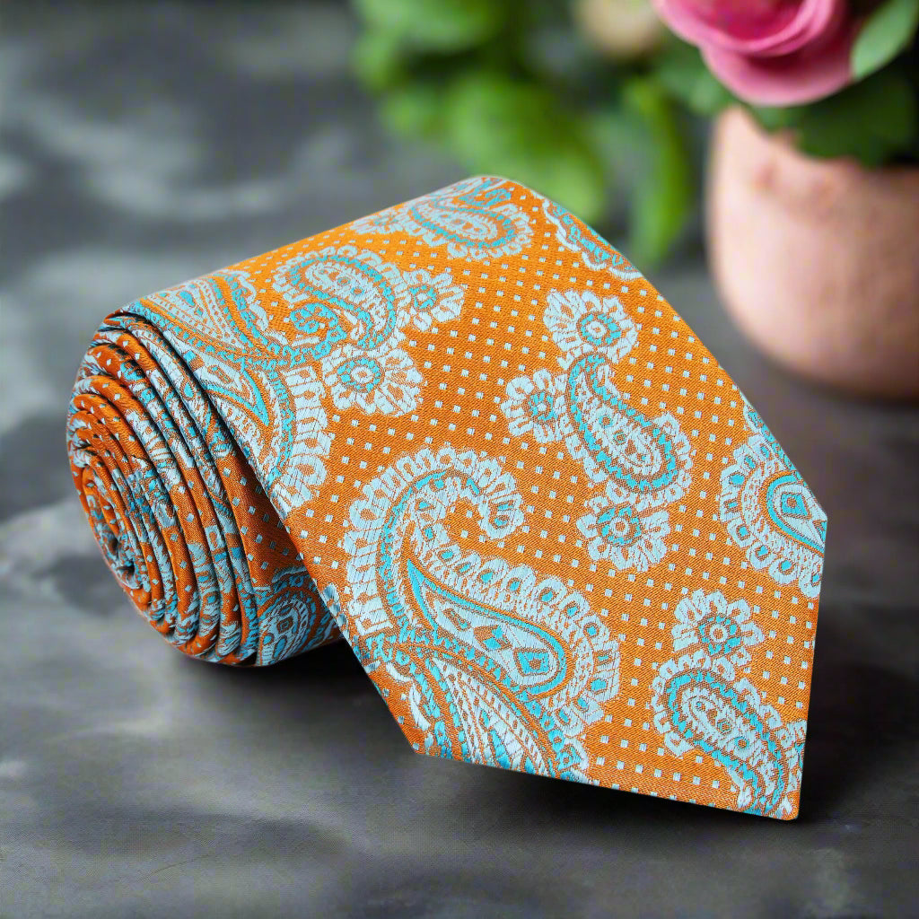 Close-up of vibrant orange paisley necktie showcasing intricate patterns