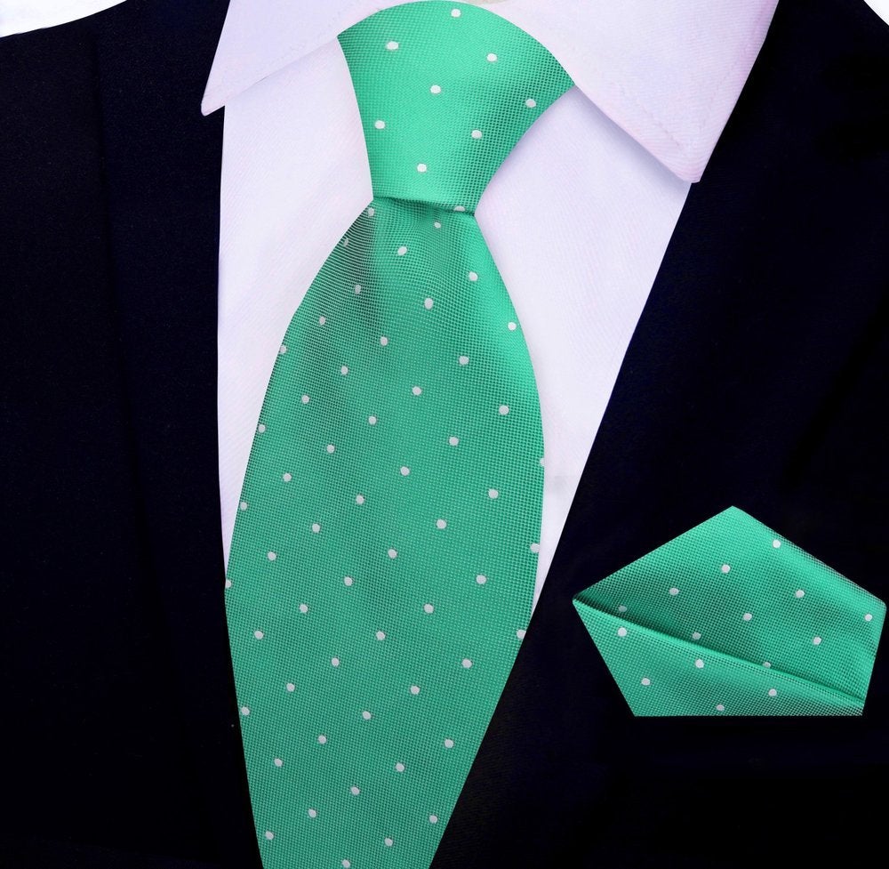Polka dot tie displayed alongside matching pocket square, designed for formal ties for business meetings
