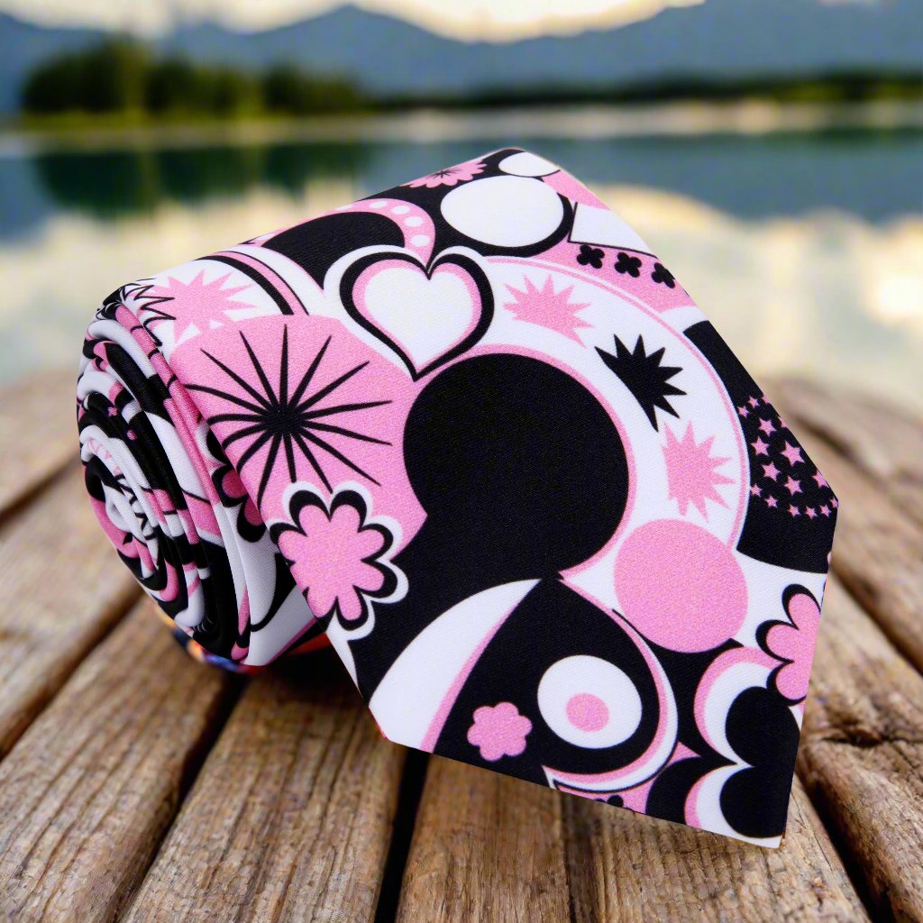 Vibrant Heartbreaker Silk Tie displayed against a white background, showcasing its colorful abstract pattern.
