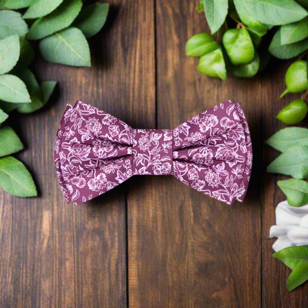 Dark pink silk bow tie with ornate pattern, ideal for formal occasions