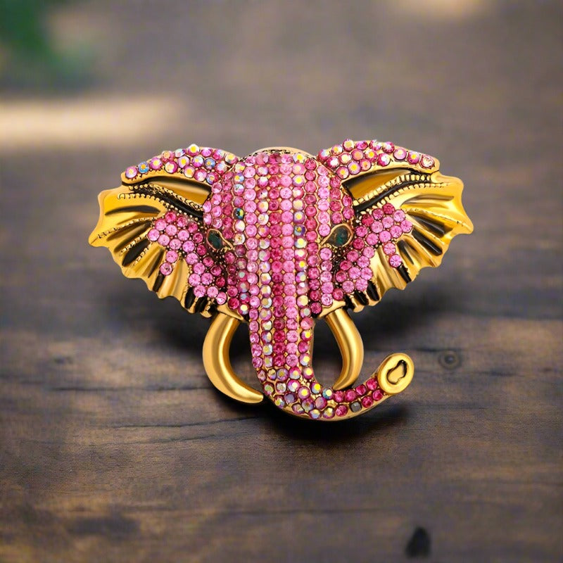 Colorful exotic animal pins with gemstones displayed for gift ideas