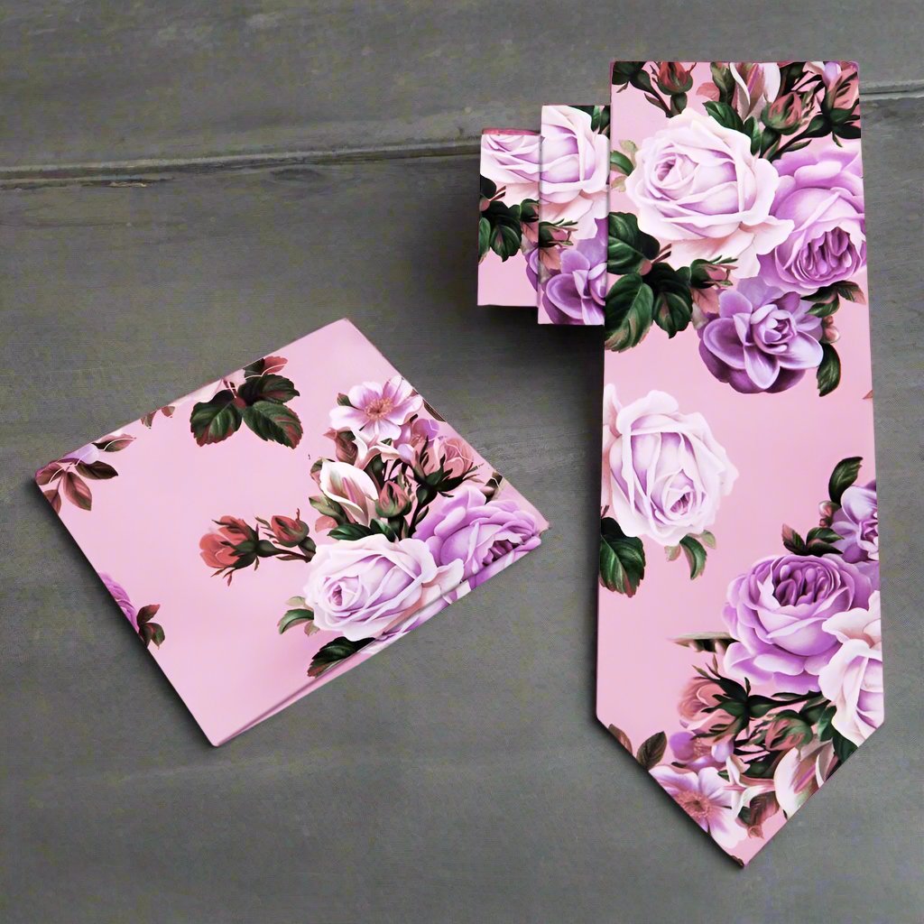 Close-up of the floral print necktie, highlighting the vibrant pink roses against a rainy day gray background.