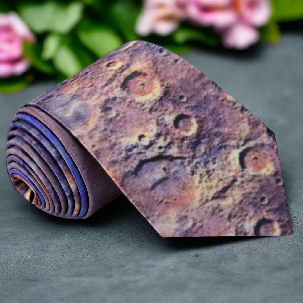 Mars Craters necktie draped over a classic navy suit, showcasing its unique pattern