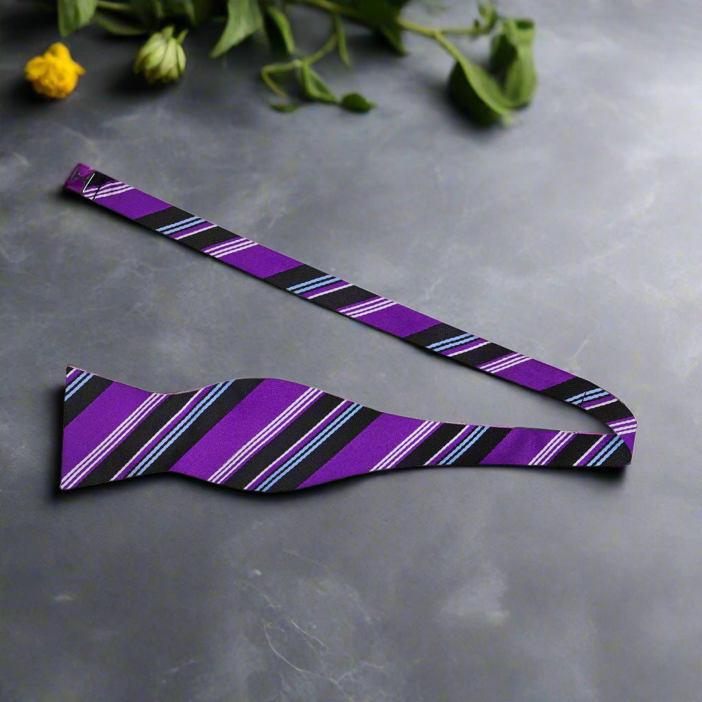Stylish red and black striped bow tie worn at a formal event, showcasing its elegance.