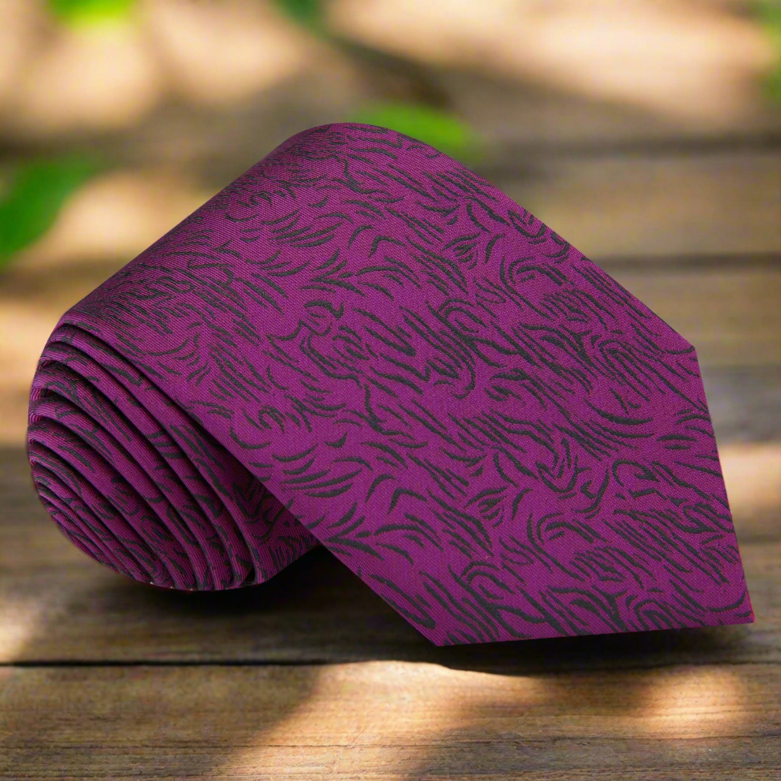 Close-up of mulberry silk necktie with abstract lines, suitable for formal events