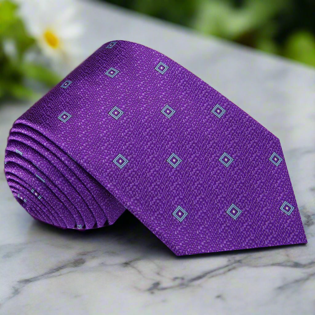 Front view of the Regalia geometric silk necktie displayed on a mannequin