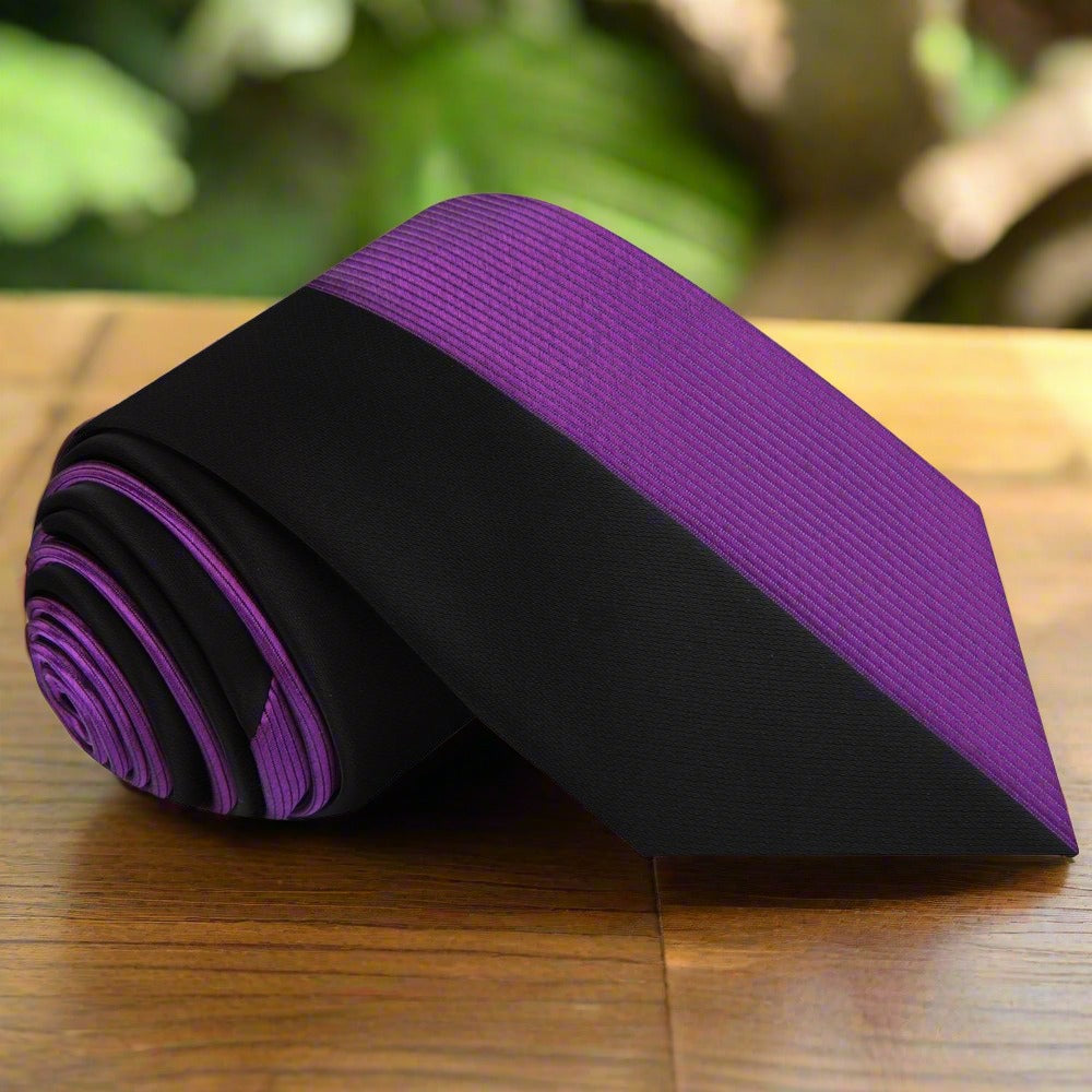 Close-up of the two-toned silk necktie showcasing the center line pattern.