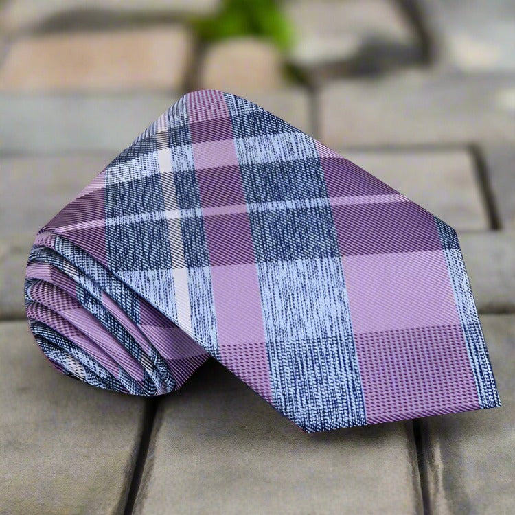 Man wearing a stylish plaid tie with a white dress shirt, perfect for office or holiday events