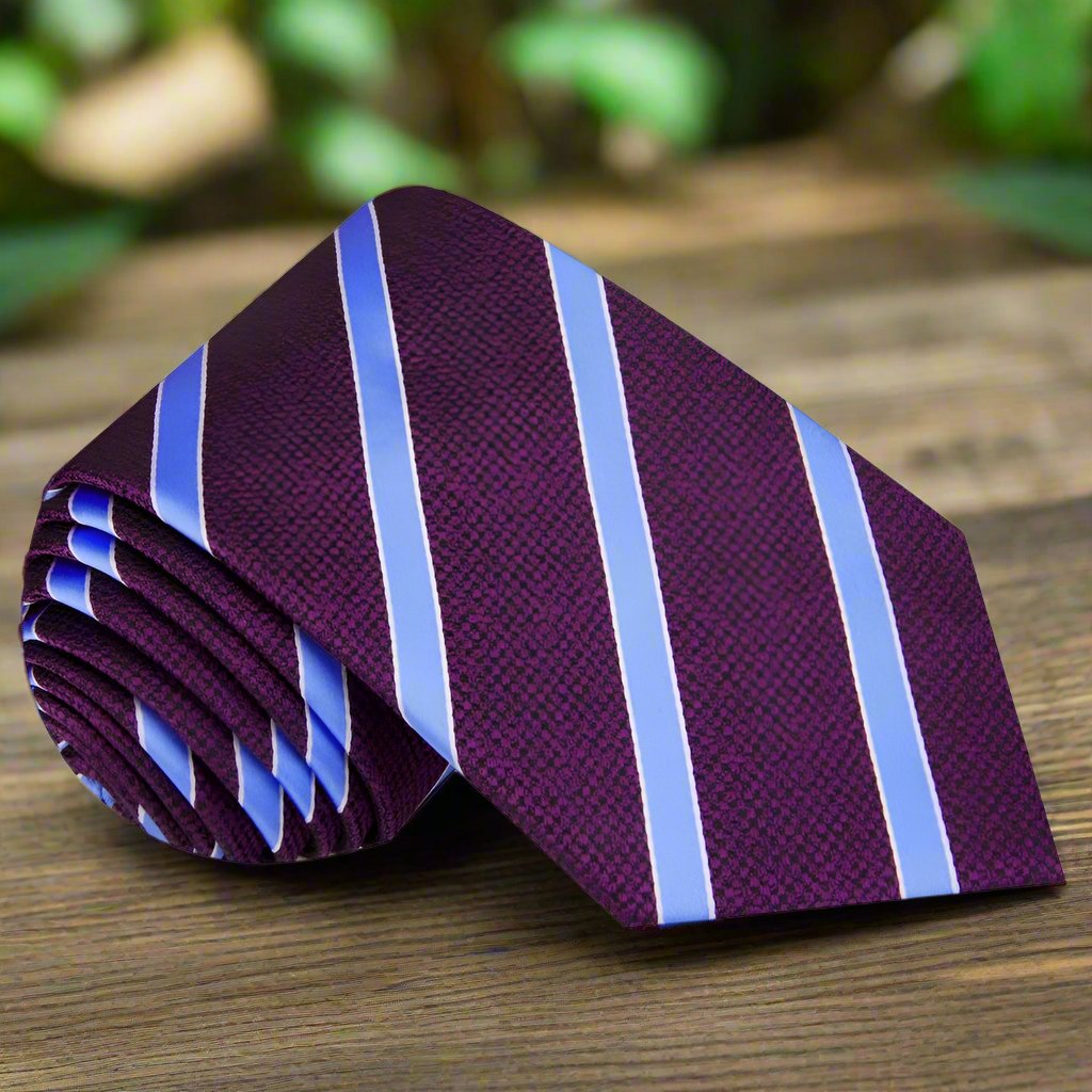 Cedar Park Stylish Necktie displayed against a navy suit, showcasing its elegant stripe pattern.