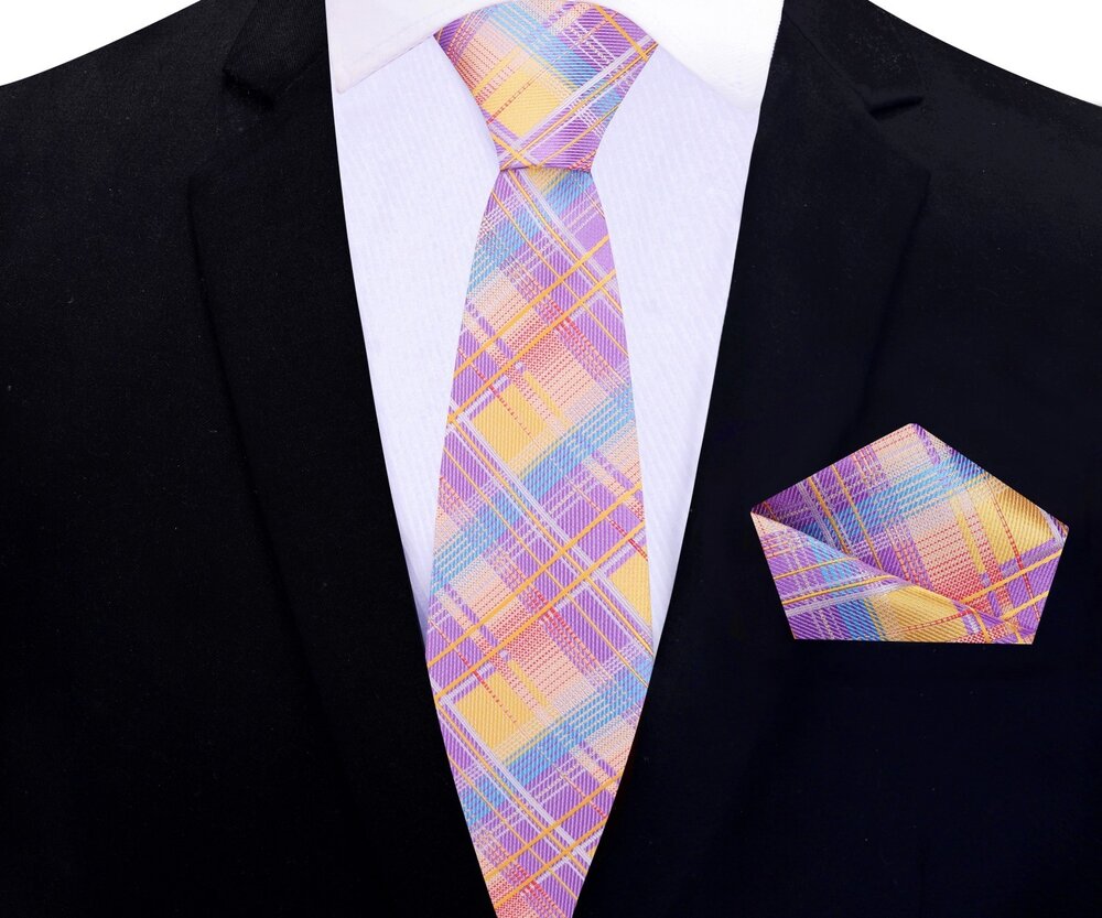 Elegant display of the silk necktie and matching pocket square in vibrant plaid design
