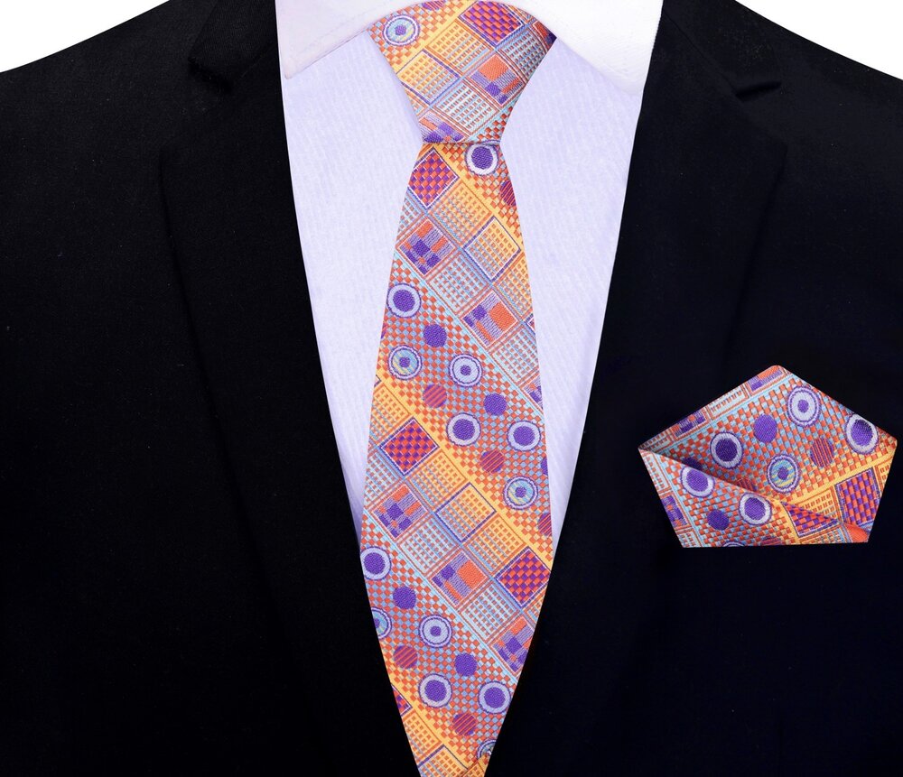 Abstract silk tie worn with a white dress shirt and navy blue suit for a corporate look.