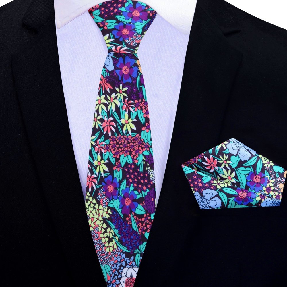 Silk floral necktie styled with navy suit for garden party