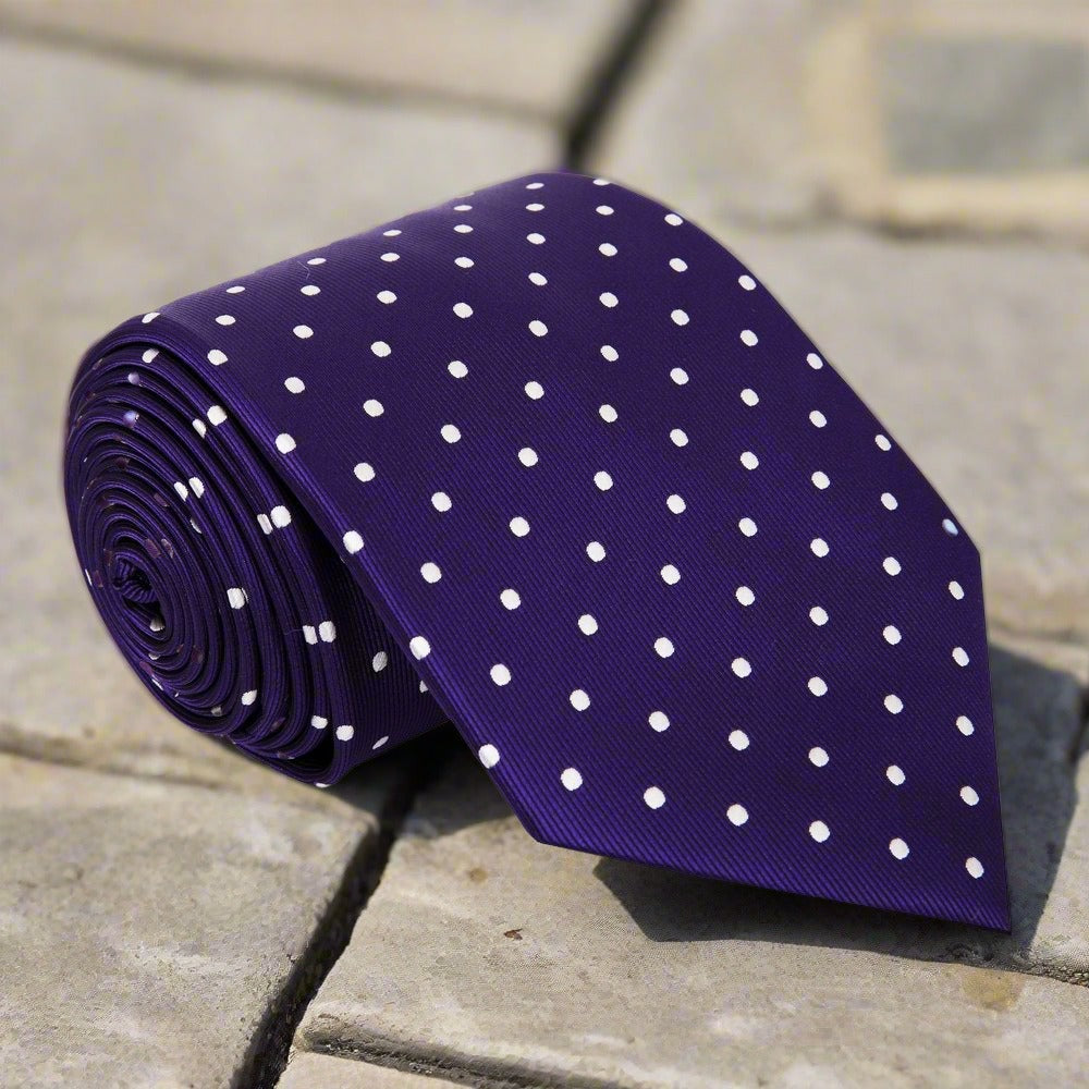 Close-up of green polka dot tie, showcasing its vibrant dots and silk texture.