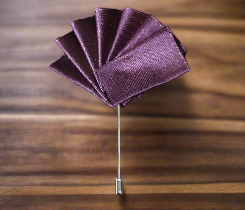 Elegant lapel pin pocket square set in blue with grey edges, showcasing versatility.