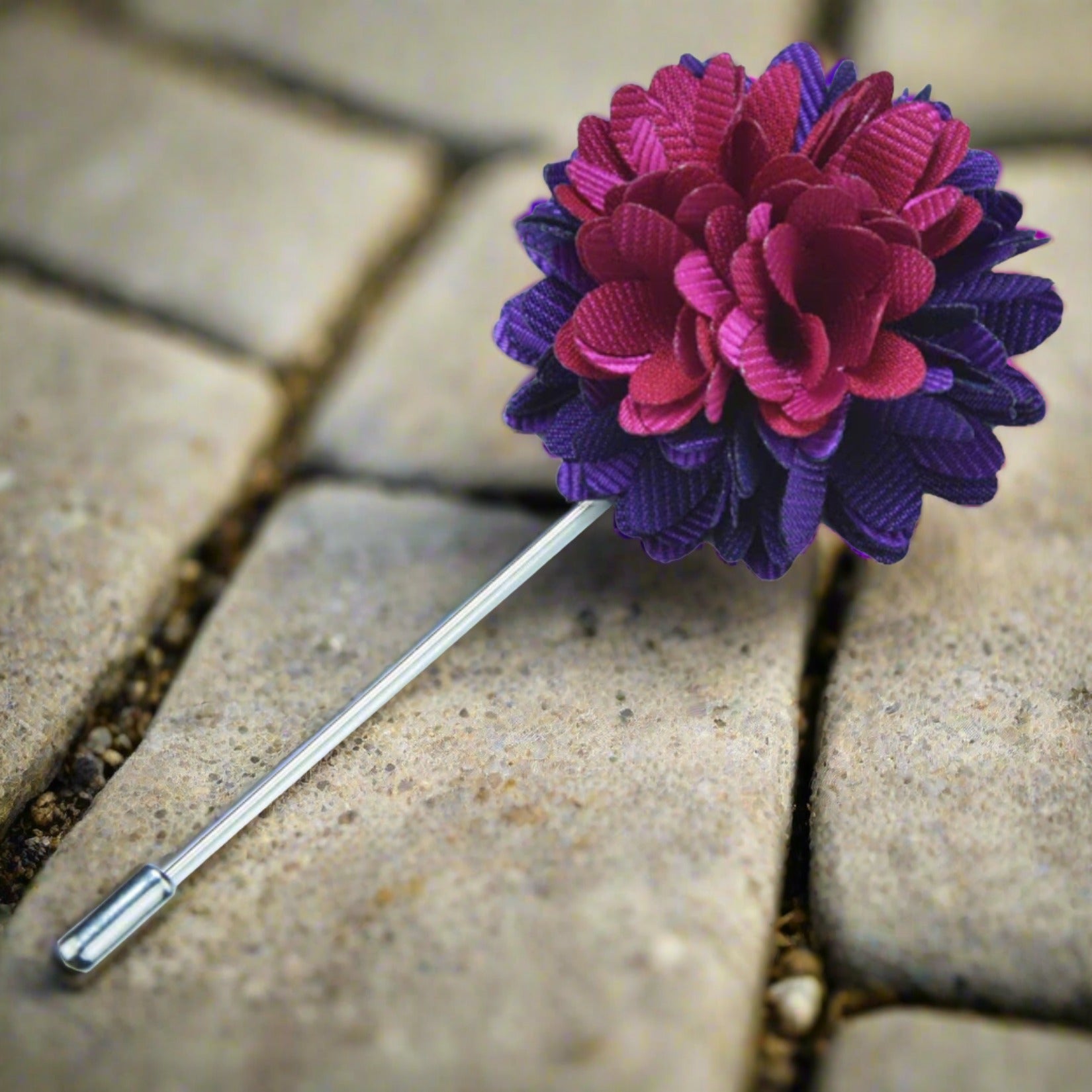 Elegant purple and pink flower lapel pin with detailed craftsmanship, ideal for formal wear