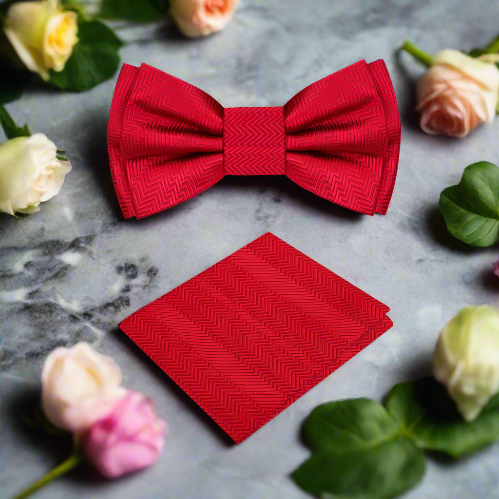 Elegant garnet red silk bow tie displayed on a classic white dress shirt, highlighting the texture and color contrast.