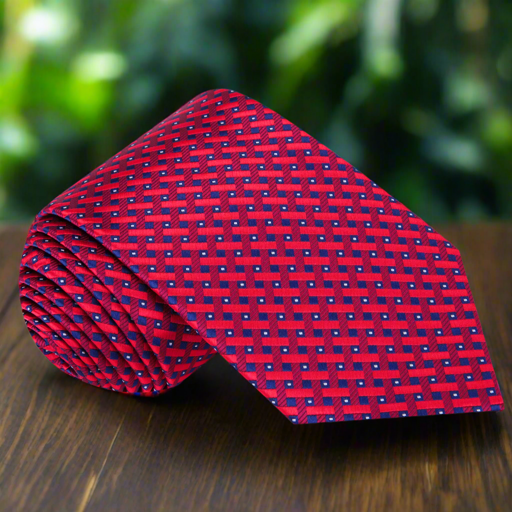 Front view of the red and blue plaid silk necktie on a mannequin