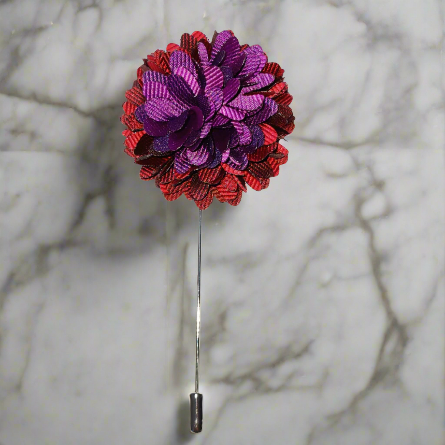 Close-up view of the premium red and purple floral lapel pin showcasing its intricate details.