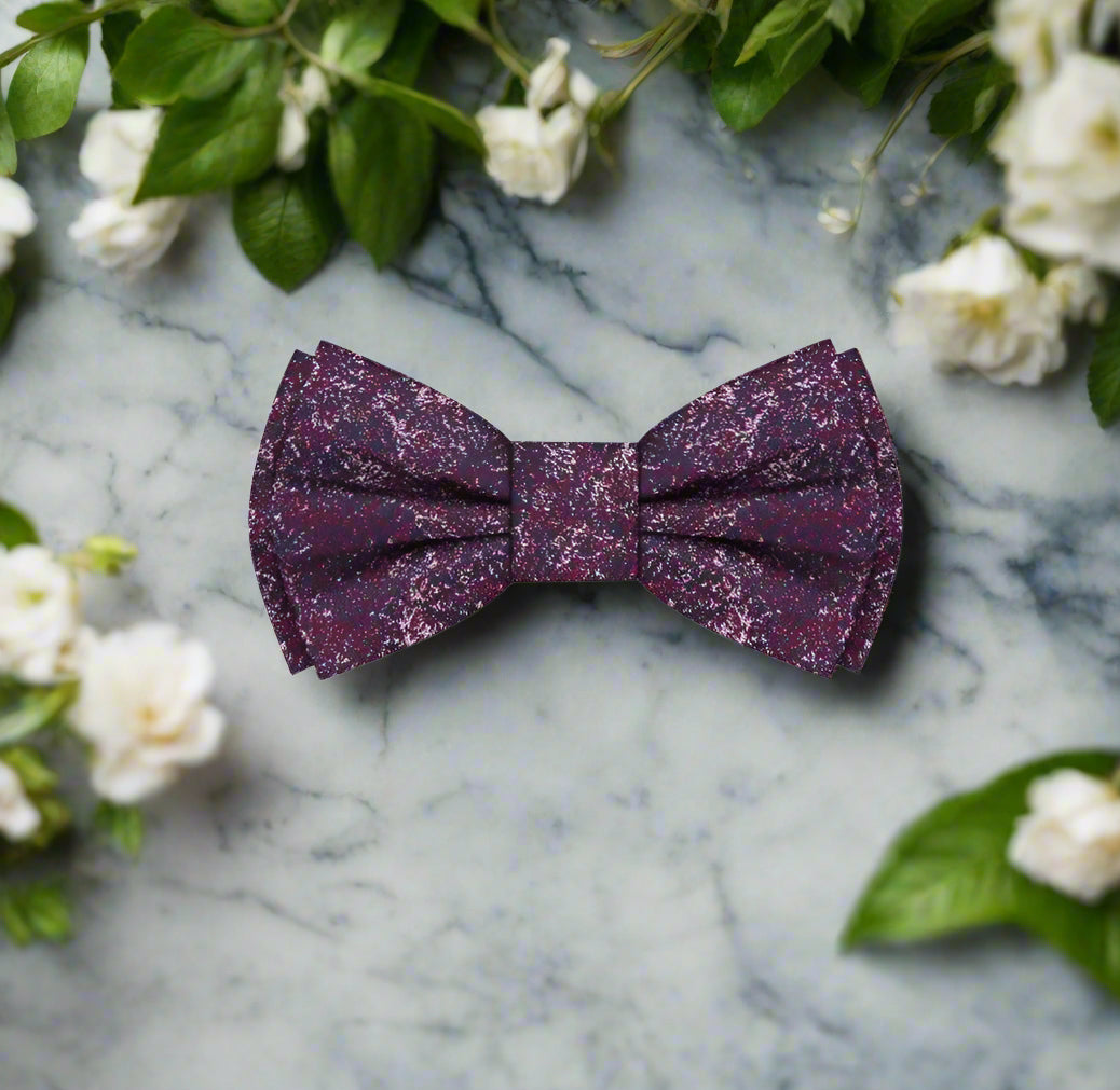 Artistic Elegance Bow Tie with red and blue abstract pattern, elegantly displayed on a suit.