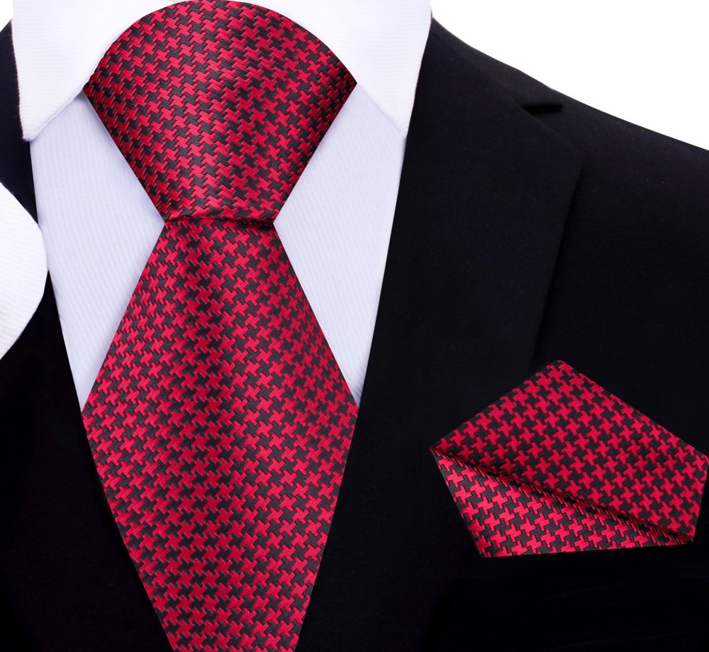 Close-up of metallic gold and black houndstooth silk necktie showcasing intricate pattern
