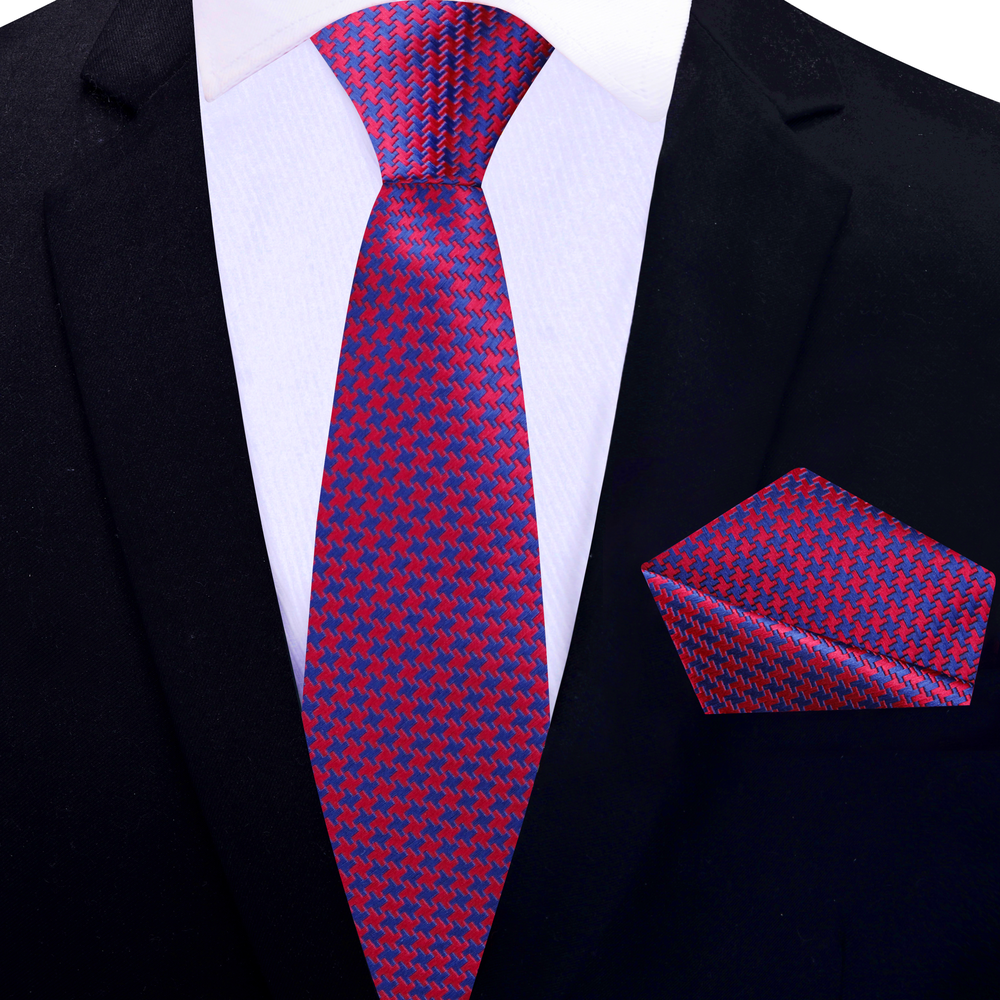 Man wearing the red and blue houndstooth necktie at a business meeting.