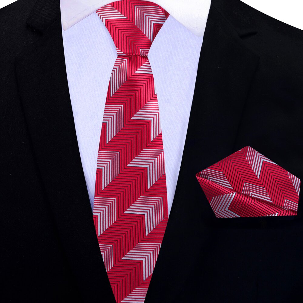 Dynamic Chevron Necktie paired with a crisp white shirt and navy suit, ideal for formal occasions.