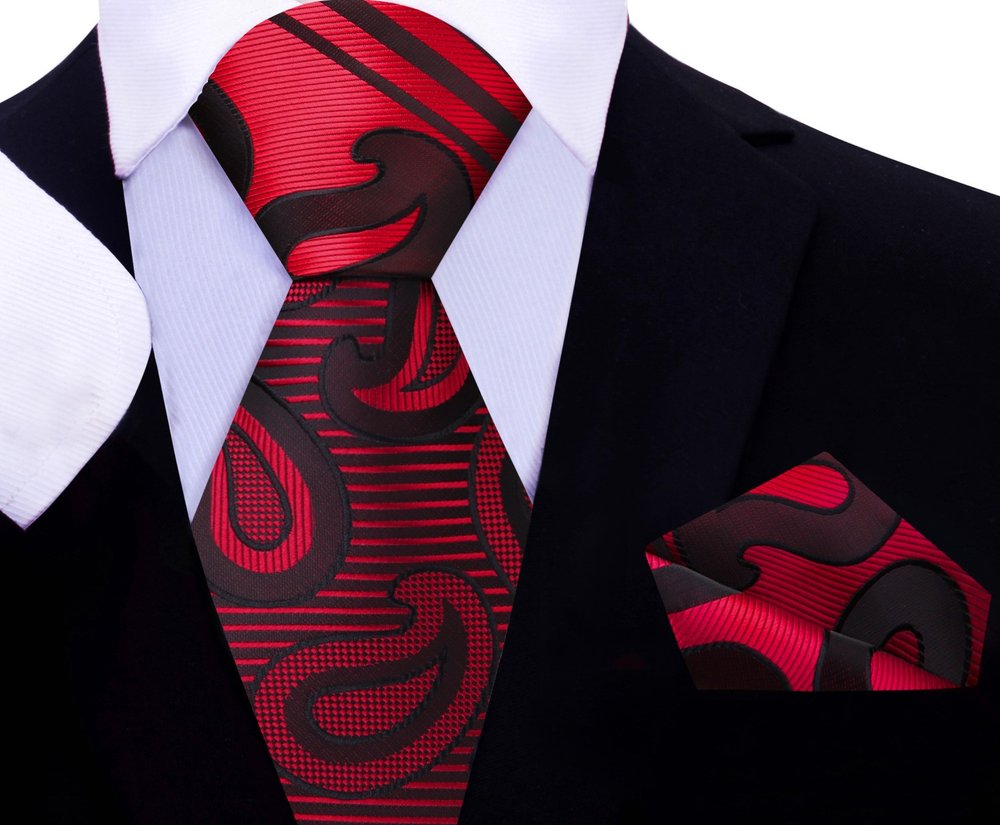Silk paisley tie styled with a crisp white shirt and navy blazer