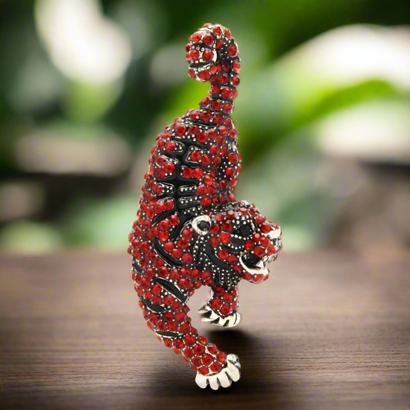 Colorful exotic animal pins with gemstones displayed for gift ideas