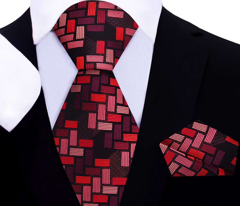 Close-up of the purple silk tie showcasing its intricate jigsaw geometric pattern.