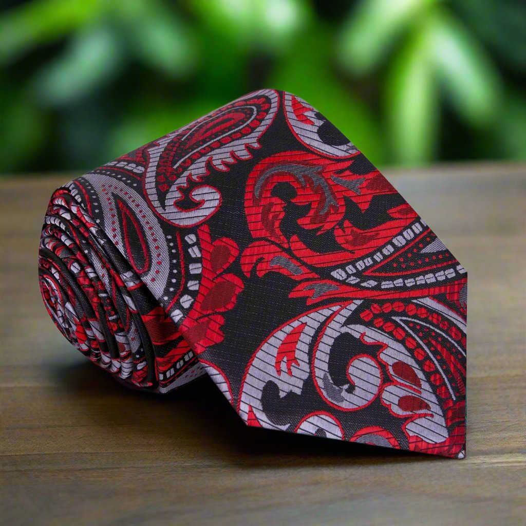 Elegant paisley necktie with intricate swirl pattern in red, grey, and black for formal wear