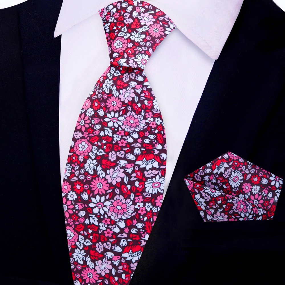 Matching pocket square for blue tie laid out on a suit jacket