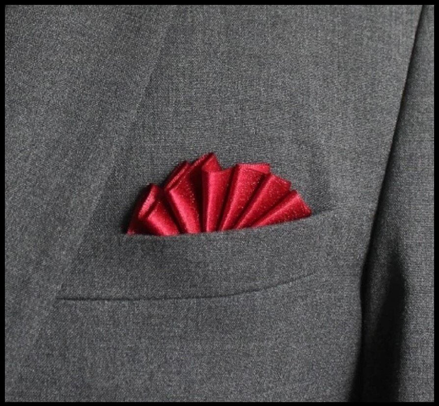 Elegant lapel pin pocket square set in blue with grey edges, showcasing versatility.