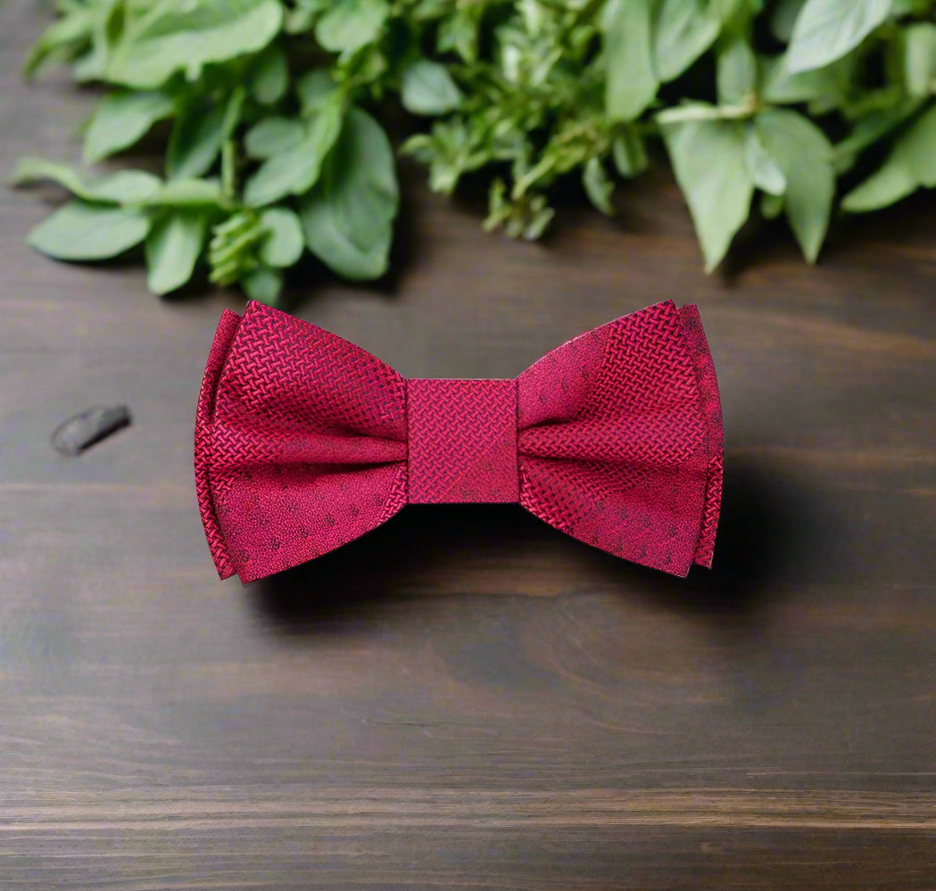 Close-up of a textured red silk bow tie for formal events