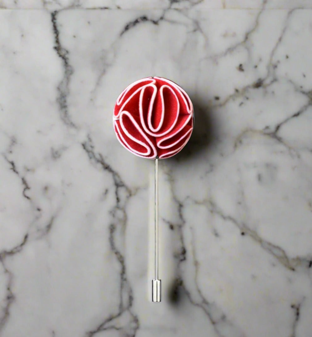 Elegant custom flower lapel pin displayed on a suit jacket.