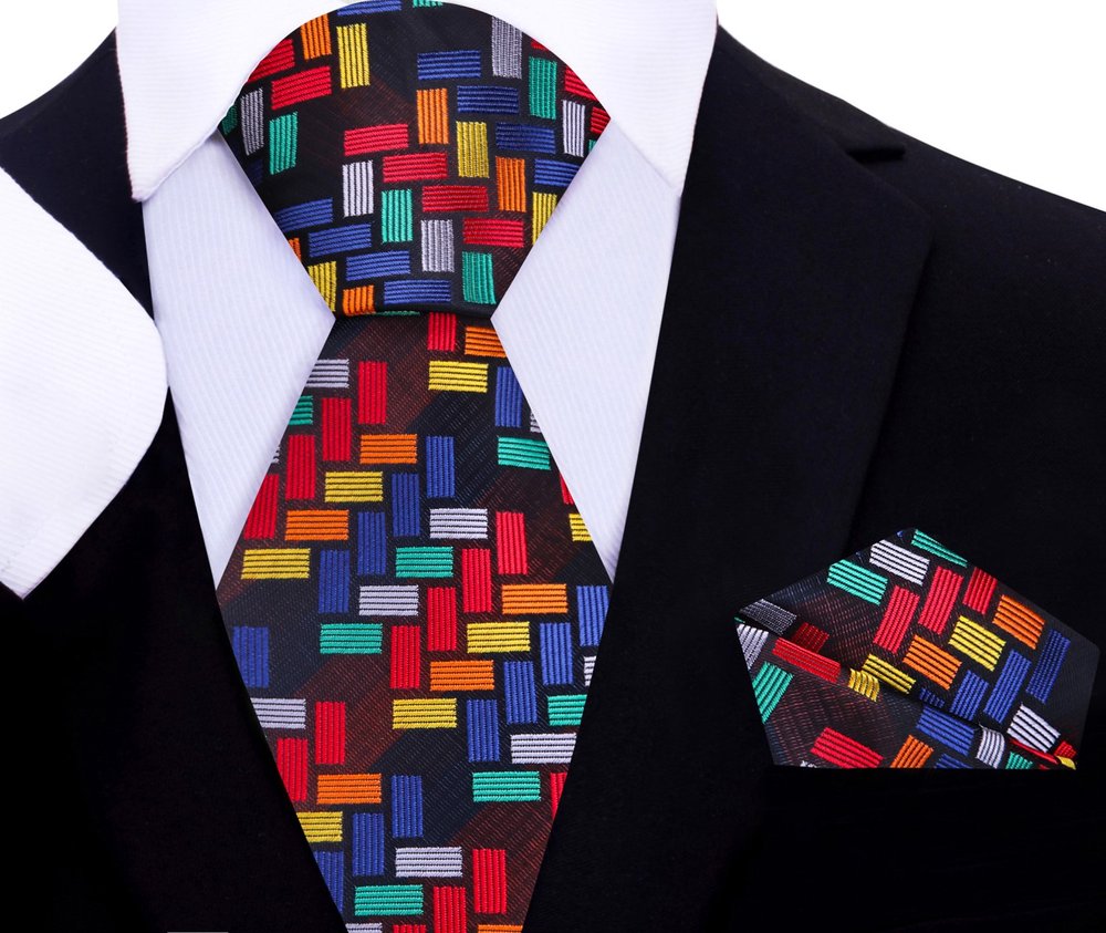 Mens silk tie worn with a white dress shirt, highlighting the vibrant purple shades.