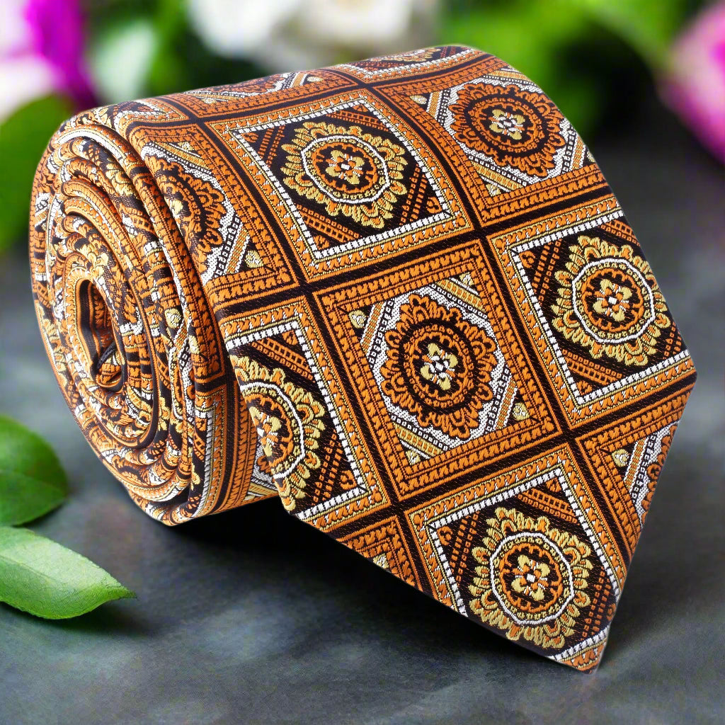 Close-up of Athens geometric necktie in orange and brown with detailed pattern