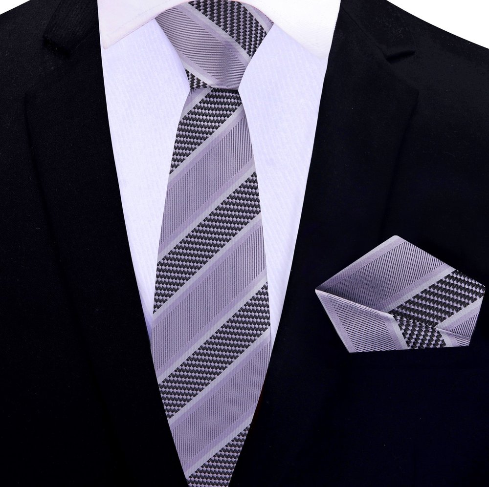 Elegant silk necktie and handkerchief set displayed on a wooden surface for networking events