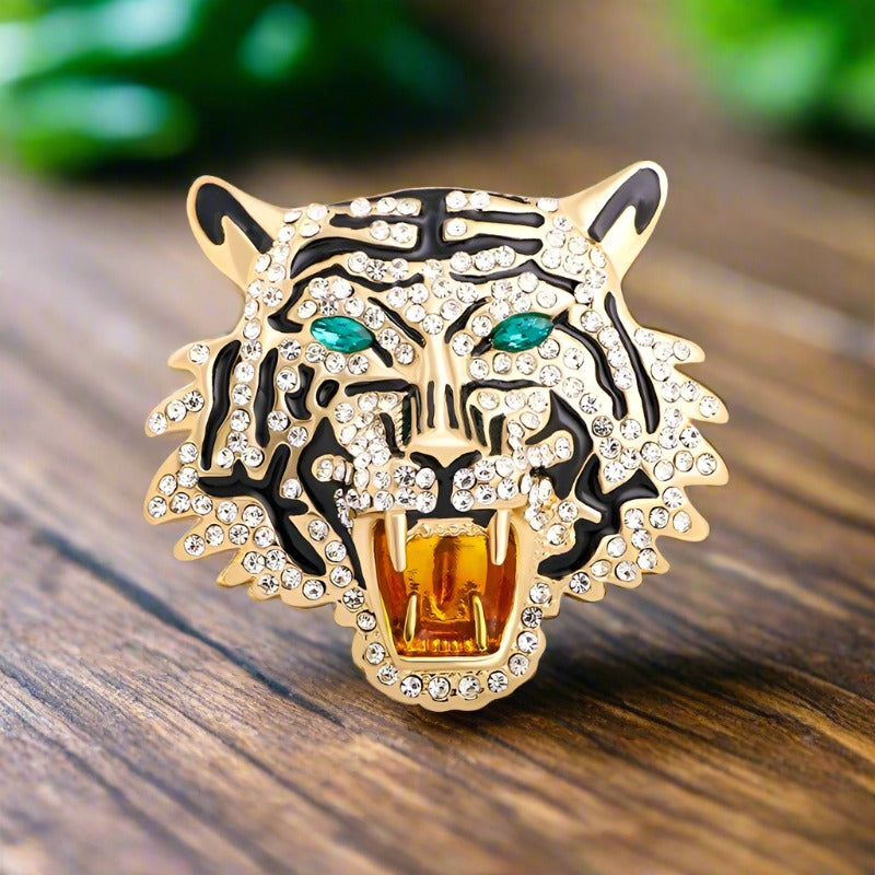 Close-up of a gemstone lion lapel pin with detailed craftsmanship