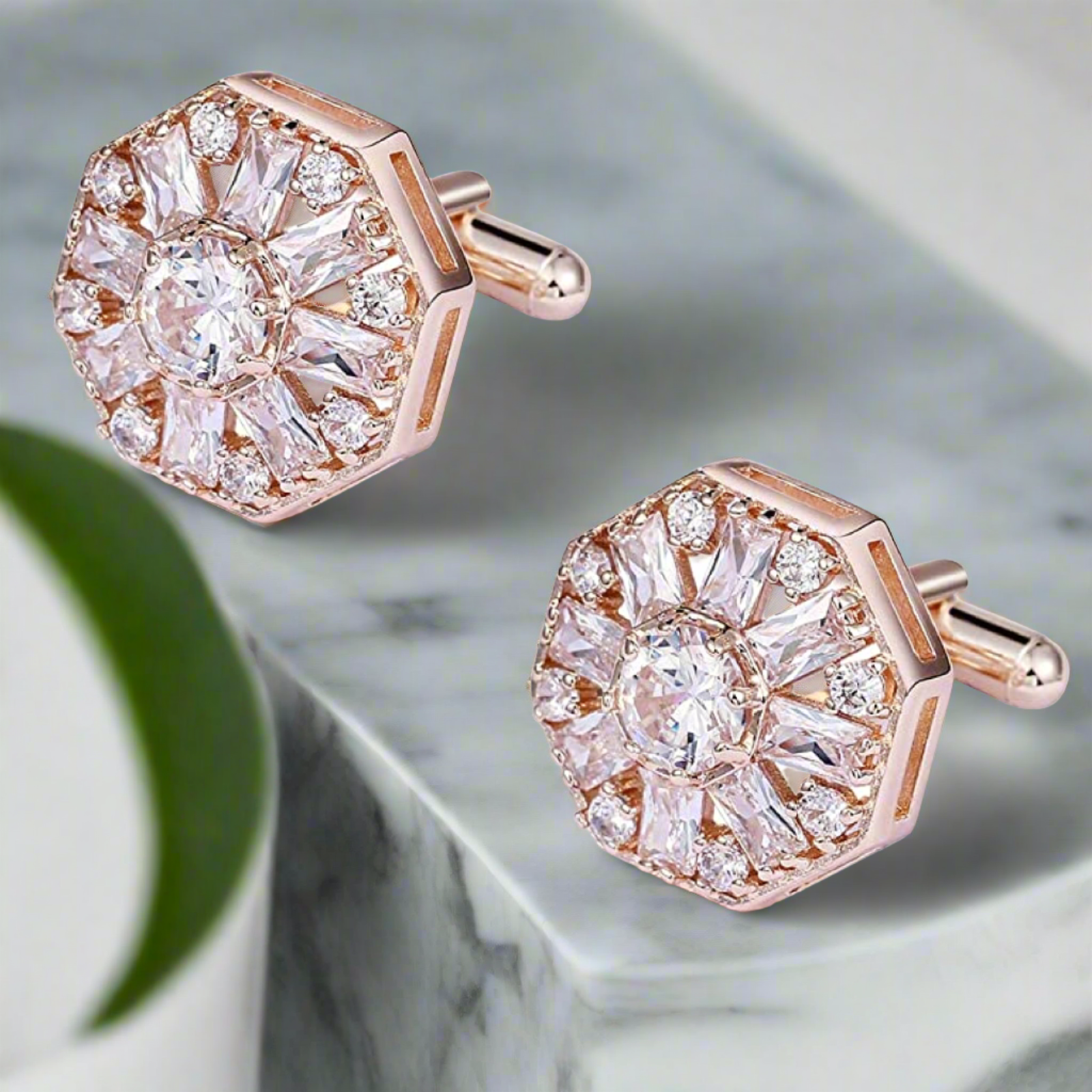 Close-up of luxury cufflinks with gemstones against a white dress shirt, highlighting their shine.