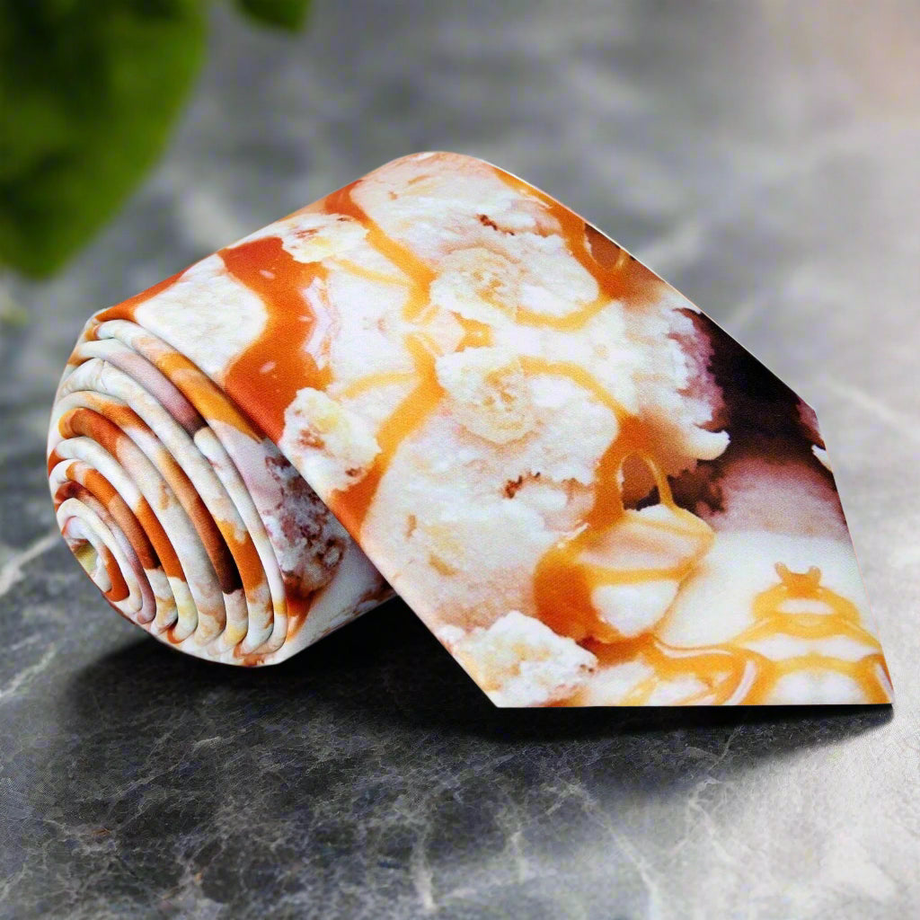 Silk necktie with playful caramel drizzle pattern, ideal for casual and networking events