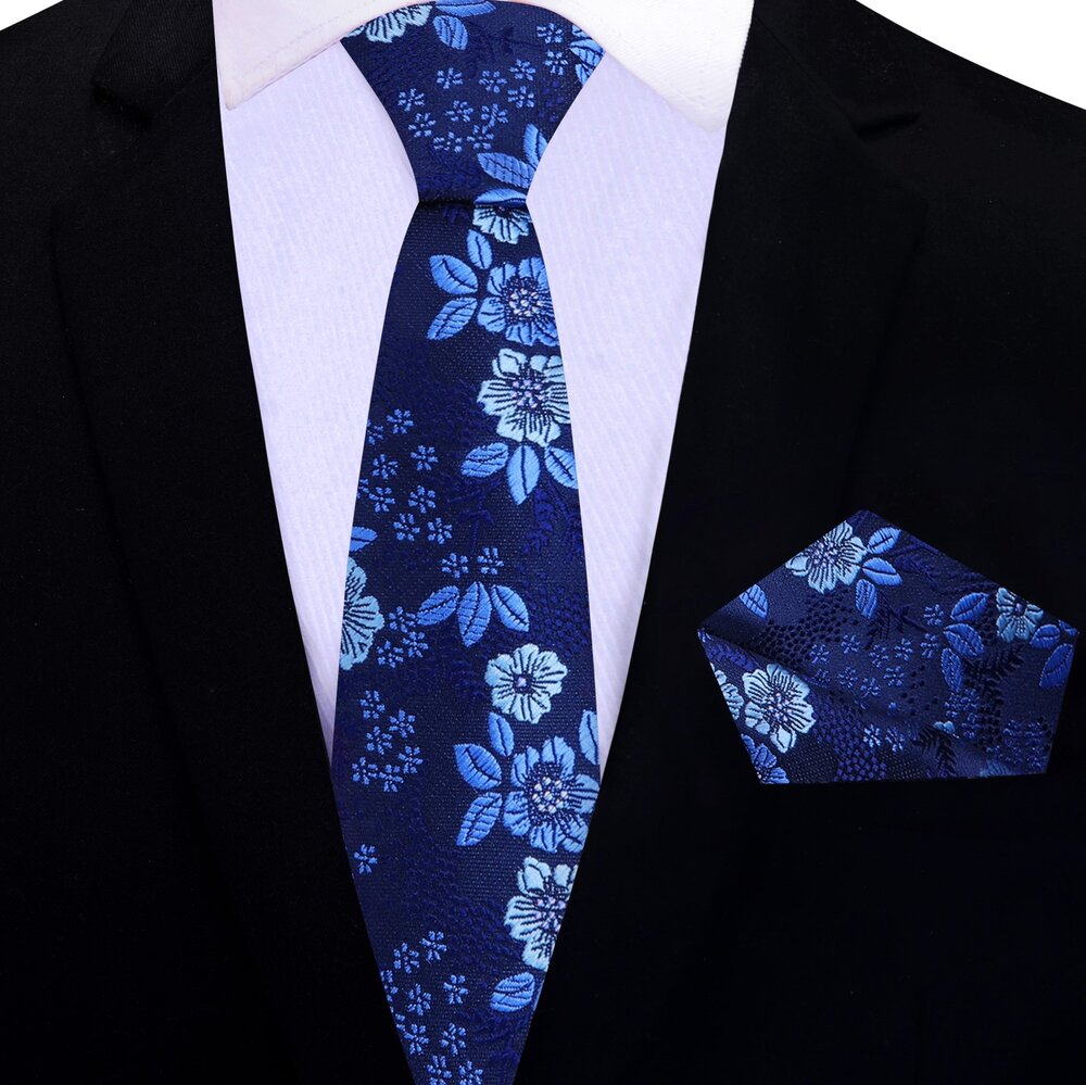 Mens floral silk tie paired with a white dress shirt for formal occasions