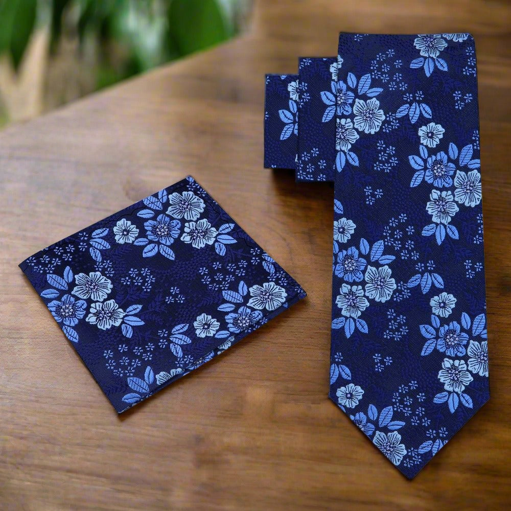 Close-up of the intricate floral pattern on a light pastel necktie for garden parties