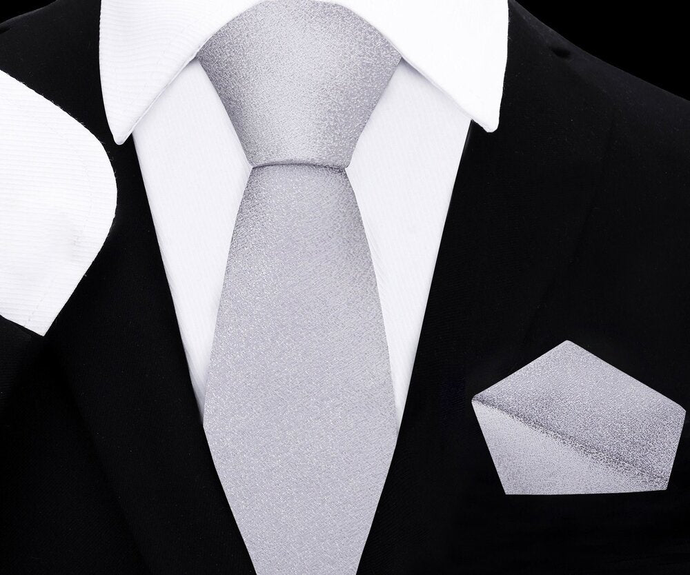 Elegant shimmer silver necktie for boys, perfectly matched with a silk pocket square.