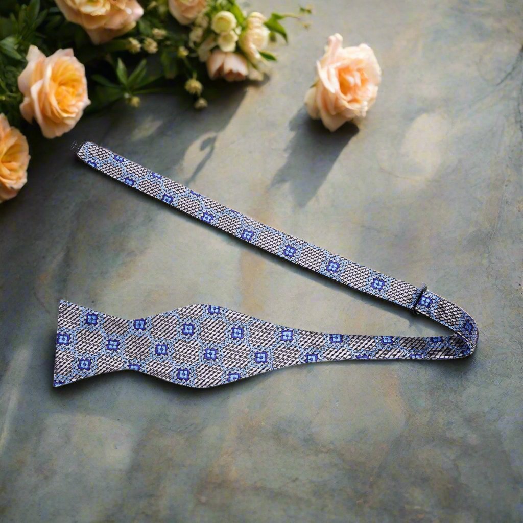Close-up view of the Jafar self-tie bow tie showcasing its geometric floral pattern, perfect for weddings.