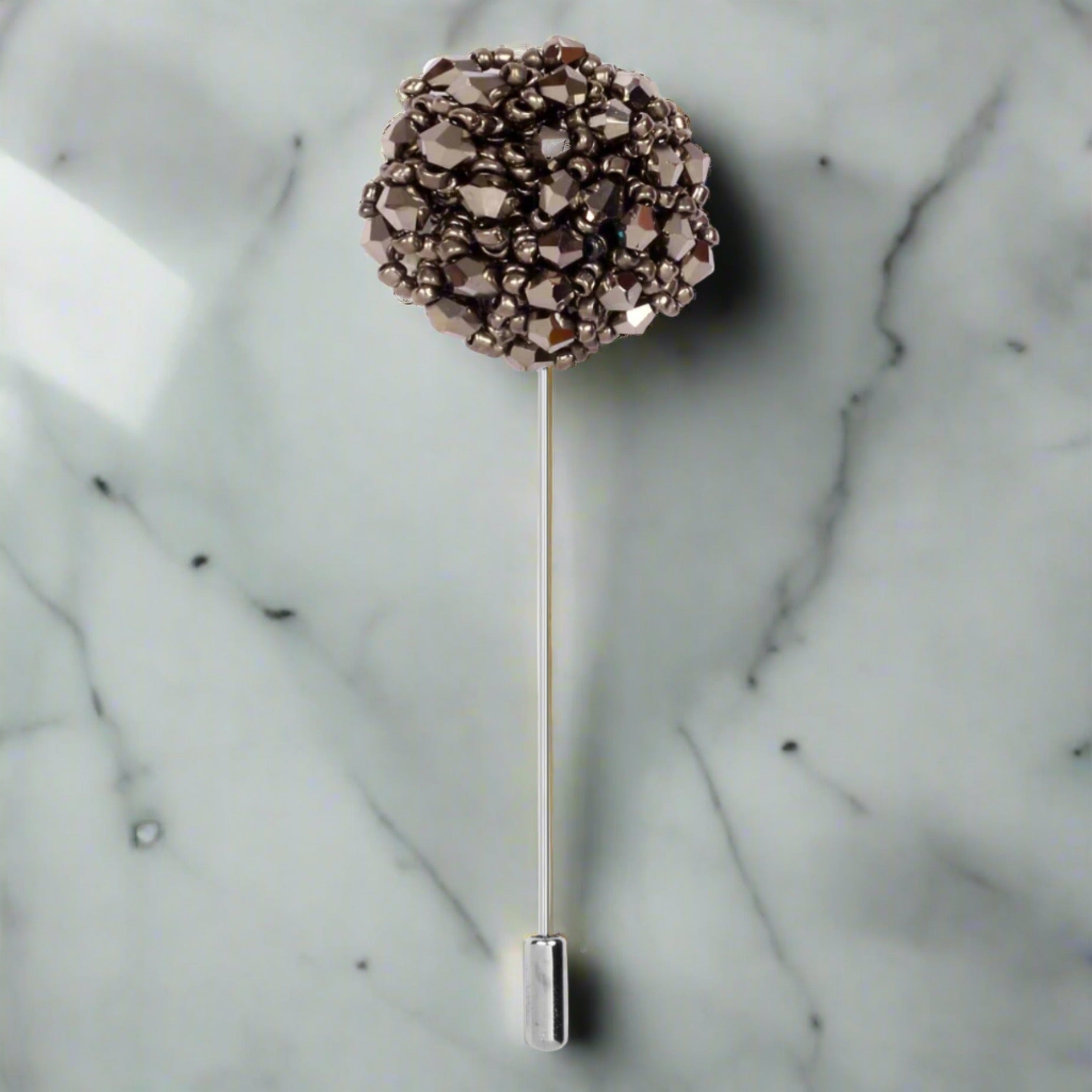 Elegant cushion lapel pin shown from the front, capturing its intricate design in silver.