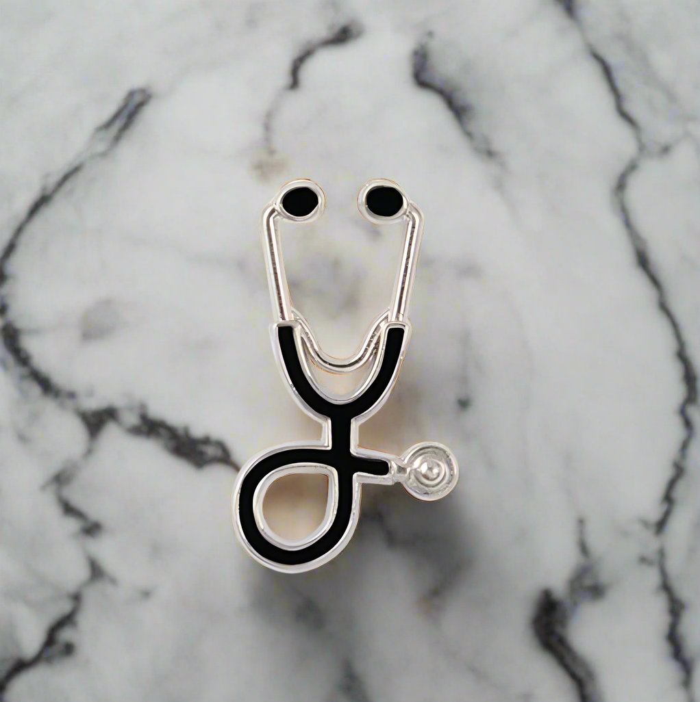 Healthcare professional wearing a stethoscope pin at a medical conference, showcasing dedication.