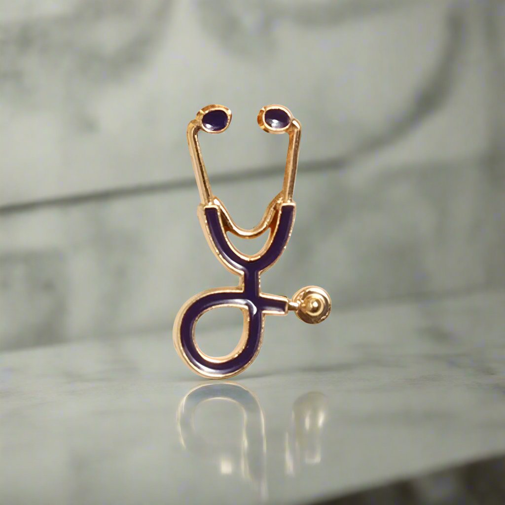 Close-up of the stethoscope lapel pin on a suit jacket, emphasizing its unique design.